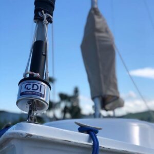 CDI Furler installed on the bow of a boat. Sail is furled with UV protection coiled to protect the sail from the sun.